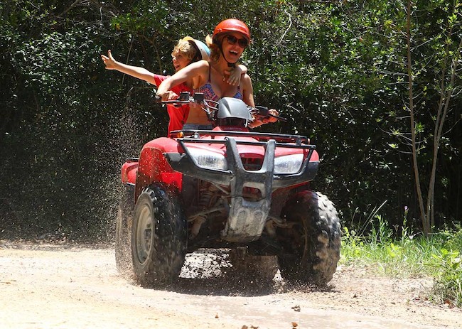 Dawn and her child having fun in their ATV excursion.