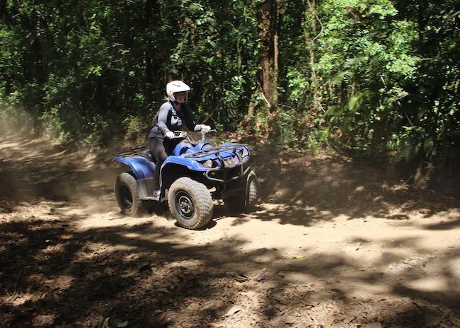 Karyn driving an ATV on her first adventure in Cozumel.