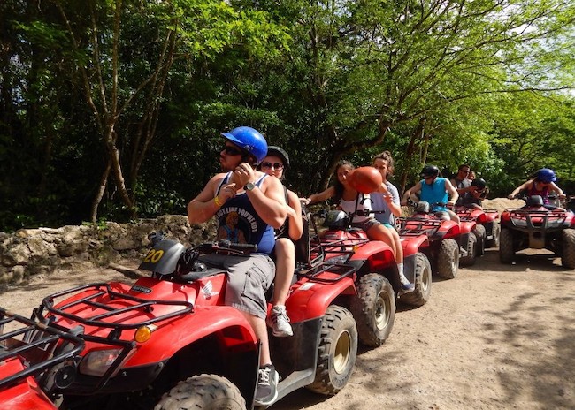 Louis and all his family preparing the ATV's for a tour in Cozumel.