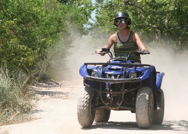 Sam accelerating her ATV in Cozumel.